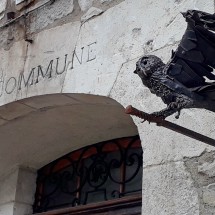 Iron owl on the wall of the town hall